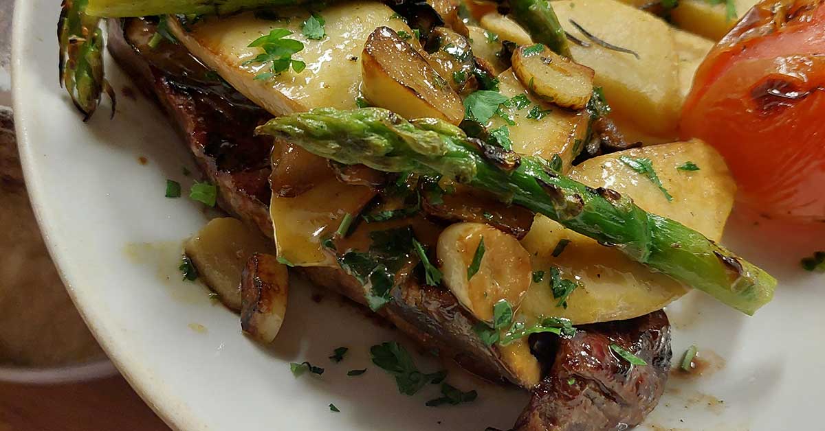 sirloin steak with king oysters mushrooms and asparagus