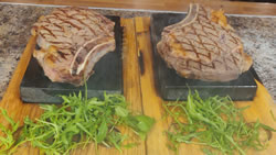 Expertly Curated Rib Eye Steak on the Bone Cooked on Hot Stone